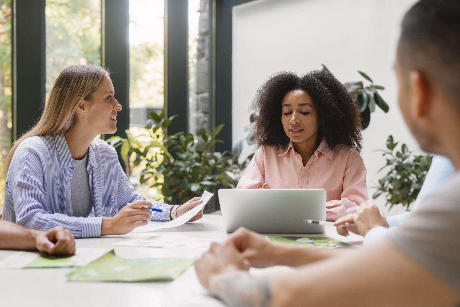 Professionals meeting around a table to discuss a young person’s support